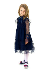 Cute smiling little girl in beautiful blue dress