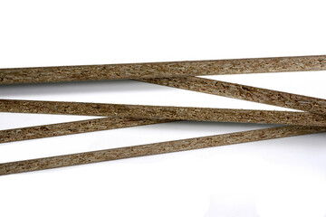 Pieces of white chipboard stacked. Material for the construction of furniture in the carpentry shop. Workplace workshop.