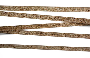 Pieces of white chipboard stacked. Material for the construction of furniture in the carpentry shop. Workplace workshop.