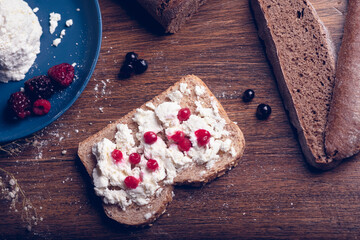 Bread with cheese and red berries.