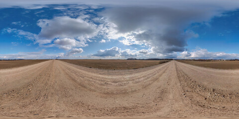 360 hdri panorama on no traffic yellow sand gravel road among fields with sky with some clouds  in equirectangular spherical projection, VR AR content.  seamless