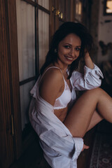 Fototapeta premium Brunette young beauty caucasian woman in white fashion lingerie