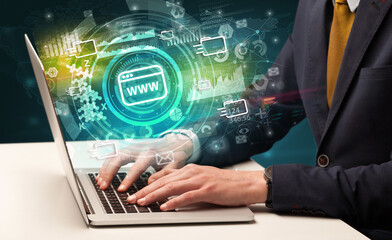 Business hand typing on a modern laptop