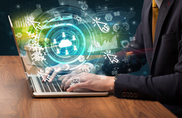 Business hand typing on a modern laptop