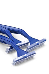 Bisposable razor. Several blue razors on white background. Сlose-up.
