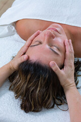 Fototapeta na wymiar Energetic massage on the face of woman