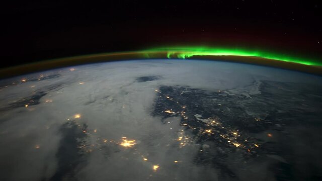 Aurora Borealis over Canada.
The International Space Station.
Source material was provided by NASA.
Color correction was done, noise was removed and slowed down.