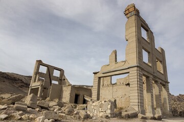 Old Bank Building Ruins in Rhyolite Ghost Town, Relic of Bygone Gold Rush Mining Days, in Nevada USA near Death Valley National Park
