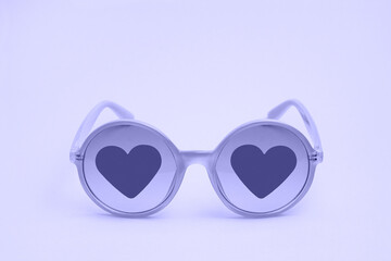 Very peri sunglasses with hearts on glasses close-up