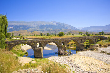Fototapeta na wymiar Landscape with ancient stone bridge in Albania 