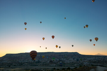 Cappadocia balloons. Hot air balloons in Goreme at sunrise.