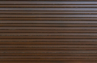 old brown external blinds on windows- texture. wooden surface. creative background