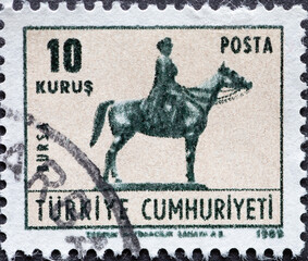 Turkey - circa 1969: A post stamp printed in Turkey showing a statue of Ataturk in the city of Bursa