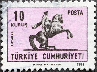 Turkey - circa 1968: A post stamp printed in Turkey showing a statue of Ataturk Antakya on horseback