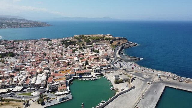 Crete, Greece. Harbor with marine vessels, boats and lighthouse. Rethymno
