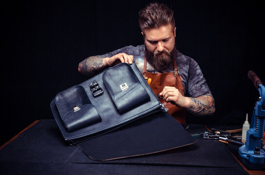 Leather Artist processes a workpiece from leather at his studio