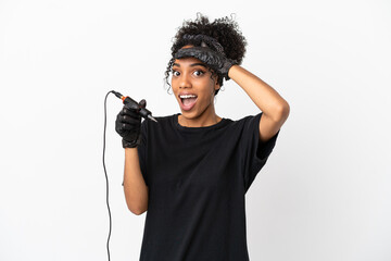 Tattoo artist latin woman isolated on white background doing surprise gesture while looking to the side