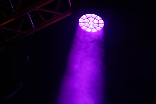 Close-up of bright purple stage light. Concert equipment