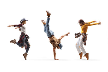 Two female dancers and one male dancer performing a hand stand - obrazy, fototapety, plakaty