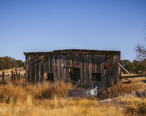 Fototapeta na wymiar Old abandoned barn that's falling apart