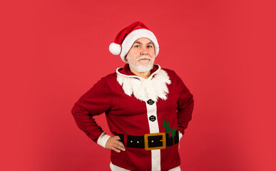 man in santa hat prepare christmas present. The morning before Xmas. enjoy the winter holiday. delivery new year gifts. Christmas online shopping. santa claus with white beard