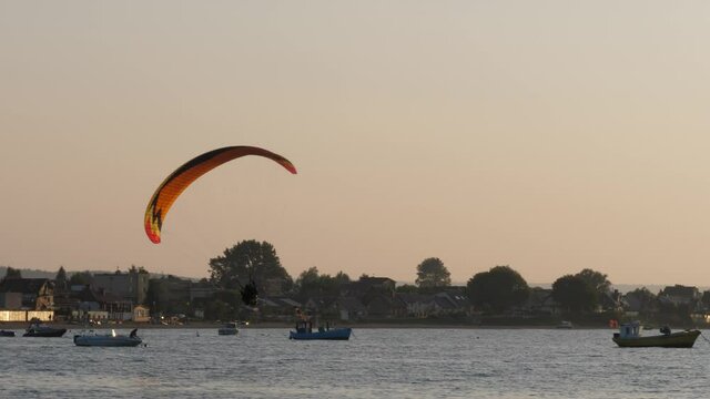 Powered paragliding (PPG) over the bay at sunset