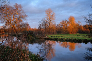 Fototapeta na wymiar Winter sunset over the River Wey in Godalming, Surrey, UK