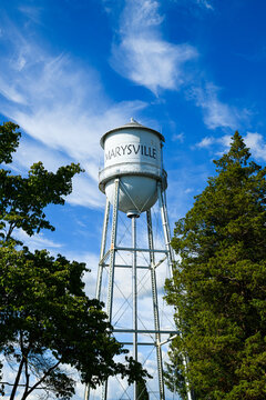 Marysville, WA, USA - June 06, 2021; Marysville water tower in the Snohomish County city against blue sky with high passing clouds