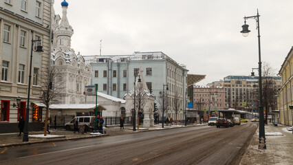Fototapeta na wymiar Moscow, Russia, Dec 02, 2021: Malaya Dmitrovka street. Direction to Pushkinskaya square Church of the Nativity of the Theotokos at Putinki