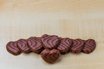 Close up view of chocolate cookies in heart shape on wooden background. Valentines day concept. Sweden.