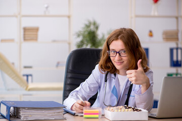 Young female doctor workiing in the clinic