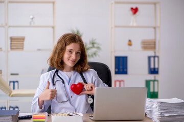 Young female doctor cardiologist workiing in the clinic