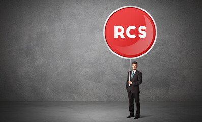 Obraz premium Young business person holdig traffic sign