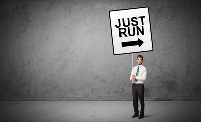 Obraz premium business person holding a traffic sign