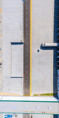 Aerial view of goods warehouse. Logistics center in industrial c