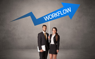 Young business person in casual holding road sign