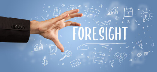 Close-Up of cropped hand pointing at business inscription