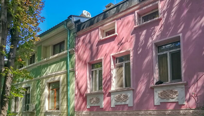 Fototapeta na wymiar Beautiful green and pink buildings in Plovdiv, Bulgaria