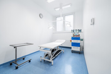 Clean and comfortable room in the hospital with examination table. Doctor's office. Doctor's room close up. Hospital check-ins.
