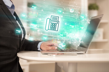 Young man watching stock market on laptop