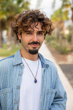 Portrait Of A Young Hispanic Boy, South European Person, Caucasian Millennial Man With Goatee And Mustache, Causal Boy