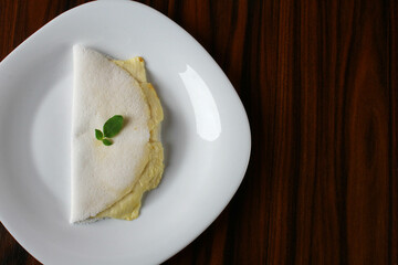 Brazilian snack called Tapioca. Tapioca stuffed white cheese. Top view with copy space.
