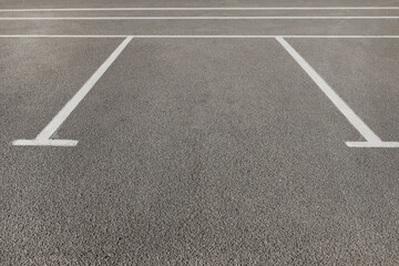 Outdoor car parking lot with white marking lines