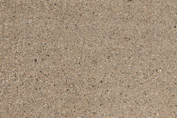 Surface of a wall with small pieces of stone