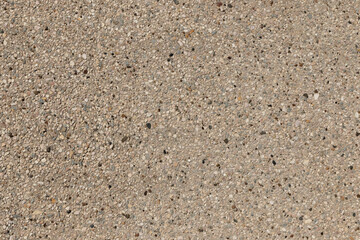 Surface of a wall with small pieces of stone