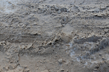 Textures. Snow slush with dirt and footprints on the road.