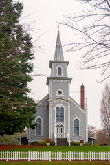 Fototapeta na wymiar St. Paul's Church - Port Gamble, WA. Built in 1913 this church is located in the historic town of Port Gamble in the southern part of town and just off State Route 104.