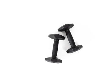 Two dumbbells in black on an isolated white background. Healthy lifestyle concept. View from above
