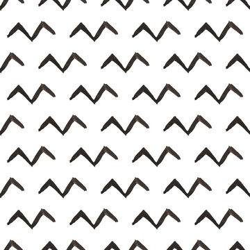 Seamless pattern with black zigzag lines on white, symbol of flying birds, simple geometric pattern