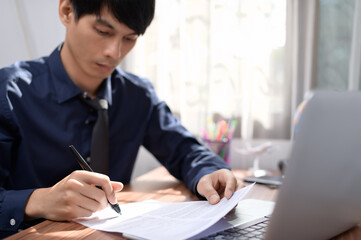 businessman writing documents signing documents